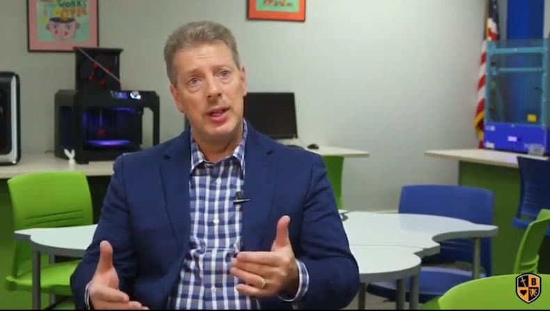 Bill Barna, retired police officer, speaking in a school classroom